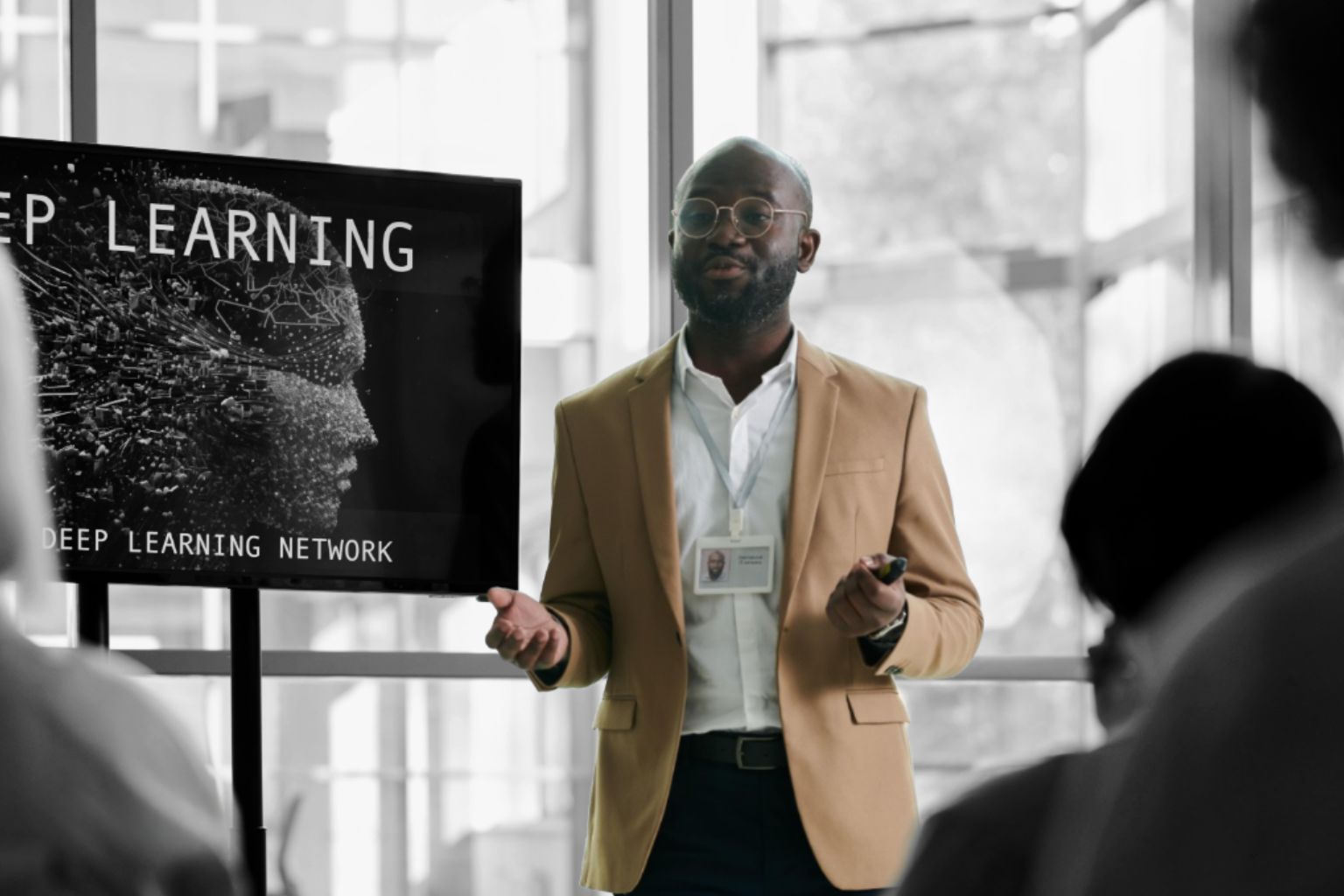 Man presents on deep learning network with screen
