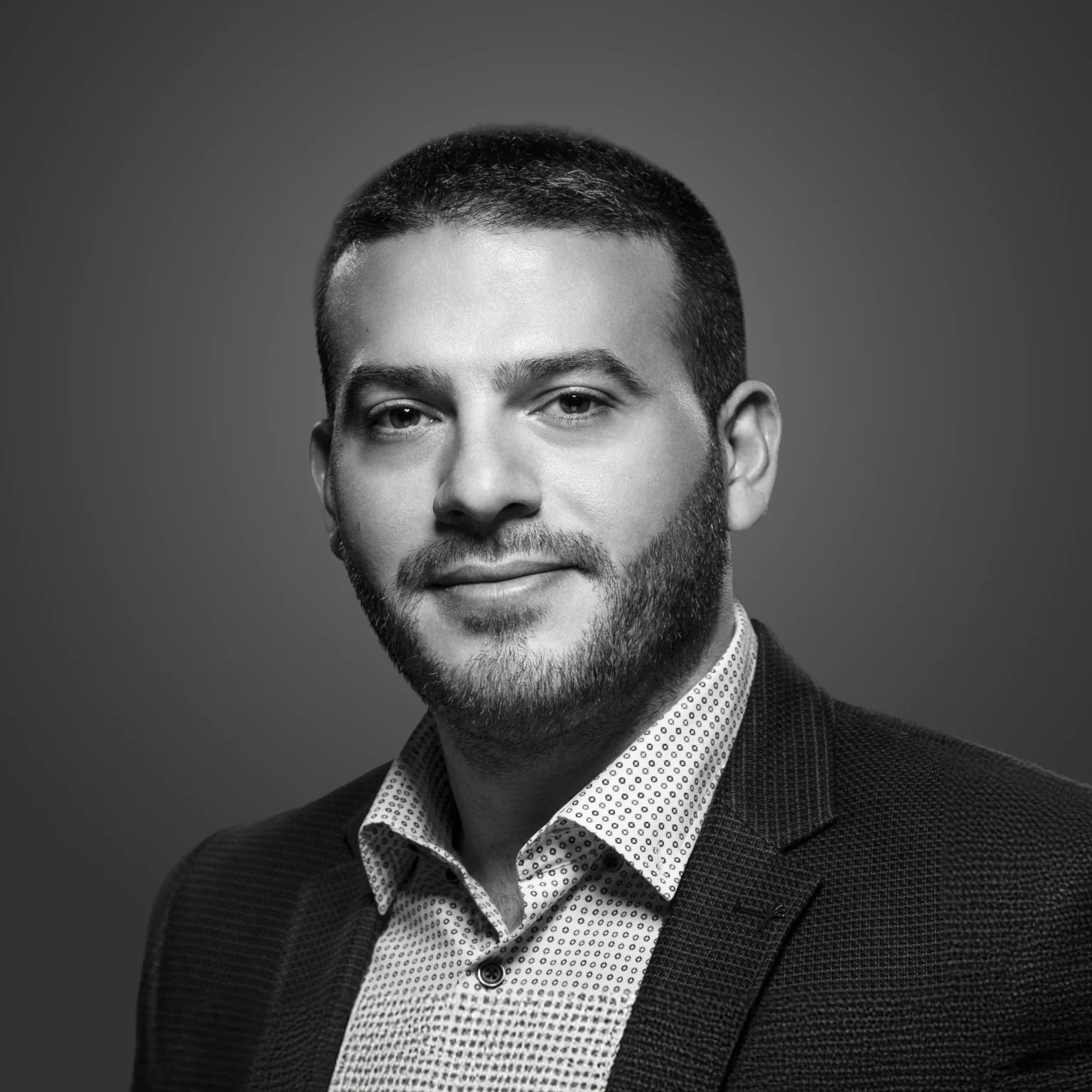 Portrait of a man in a suit.