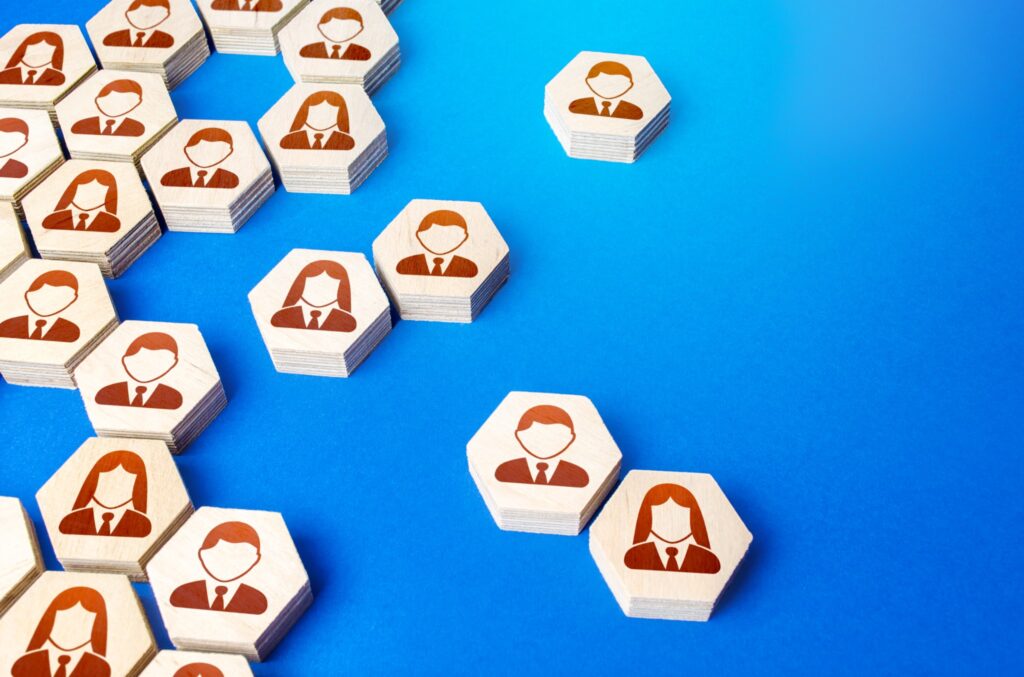 Wooden blocks with human icons on blue background.