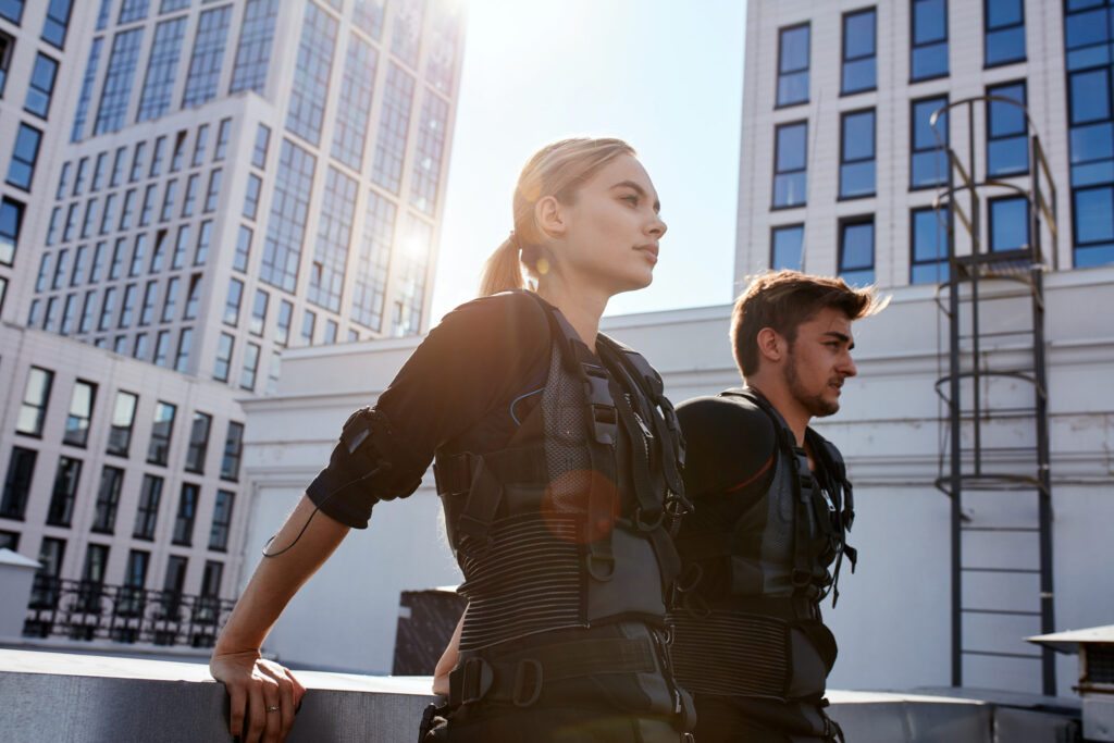 Two people in tactical gear on rooftop
