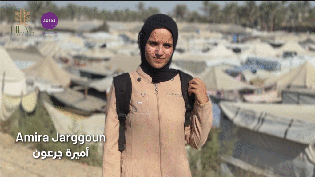 Person in camp with tents background.