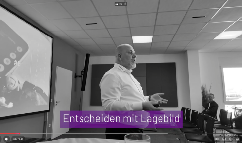 Man presenting in a meeting room.