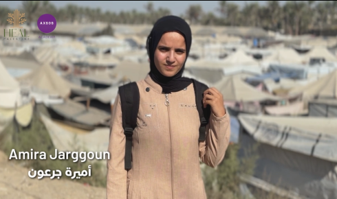 Person in camp with tents background.