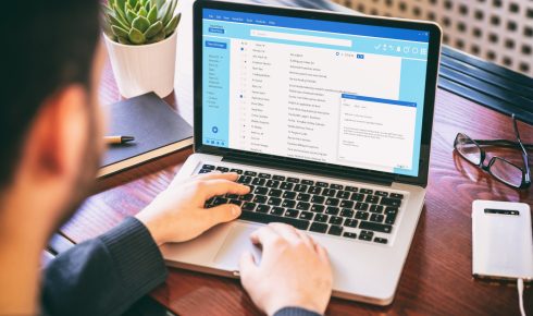Person checking email on a laptop.